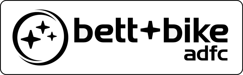 Logo with stylized stars and bold text: bett+bike adfc, perfect for summer vacation in Ischgl.